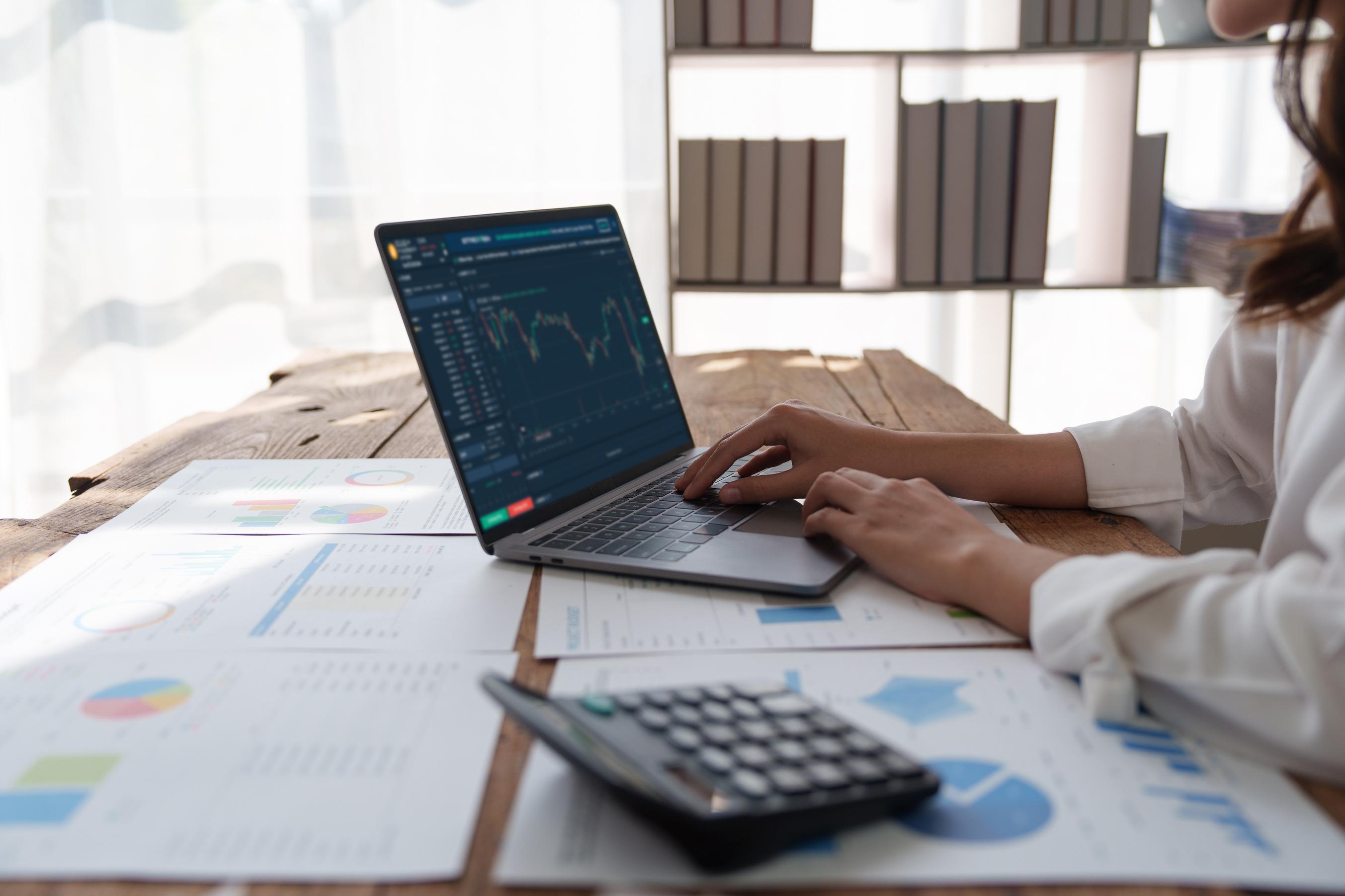 Fund managers consultation about analysis Investment stock market by laptop computer at office. fund, tax, finance concept.